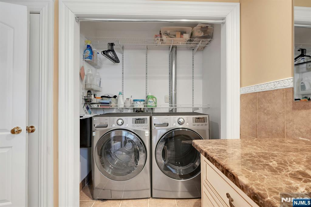 285 Chestnut Ridge Road Woodcliff Lake, NJ 07677 - Photo 34 of 46 a utility room with closet dryer and washer
