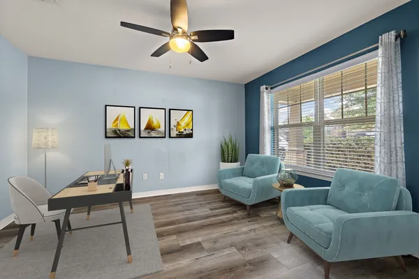a living room with furniture and a large window