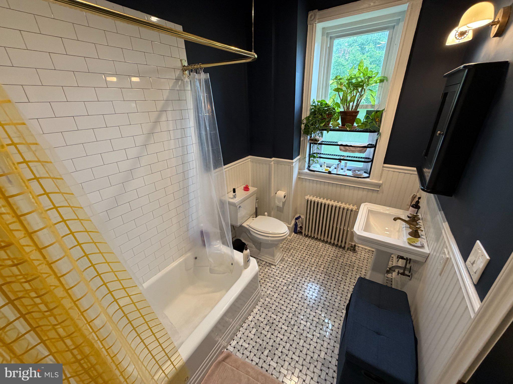 815 South 49th Street Philadelphia, PA 19143 - Photo 32 of 72 a bathroom with a sink and toilet
