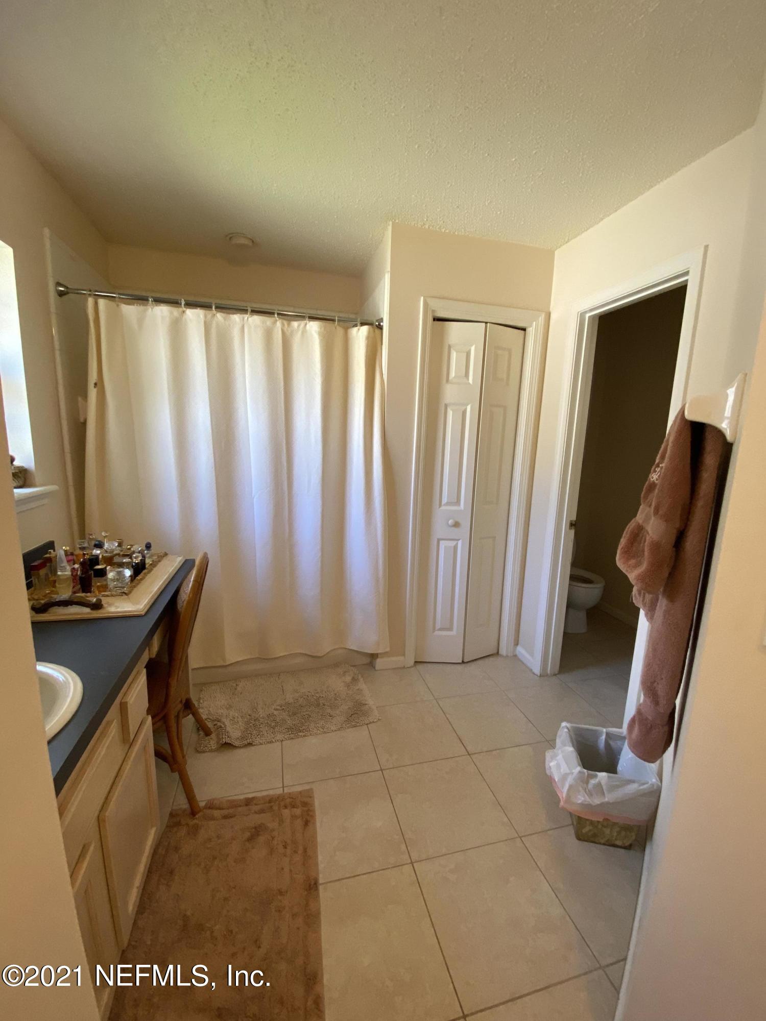 4387 Pebble Brook Drive Jacksonville, FL 32224 - Photo 19 of 30 a view of a room with furniture and a window