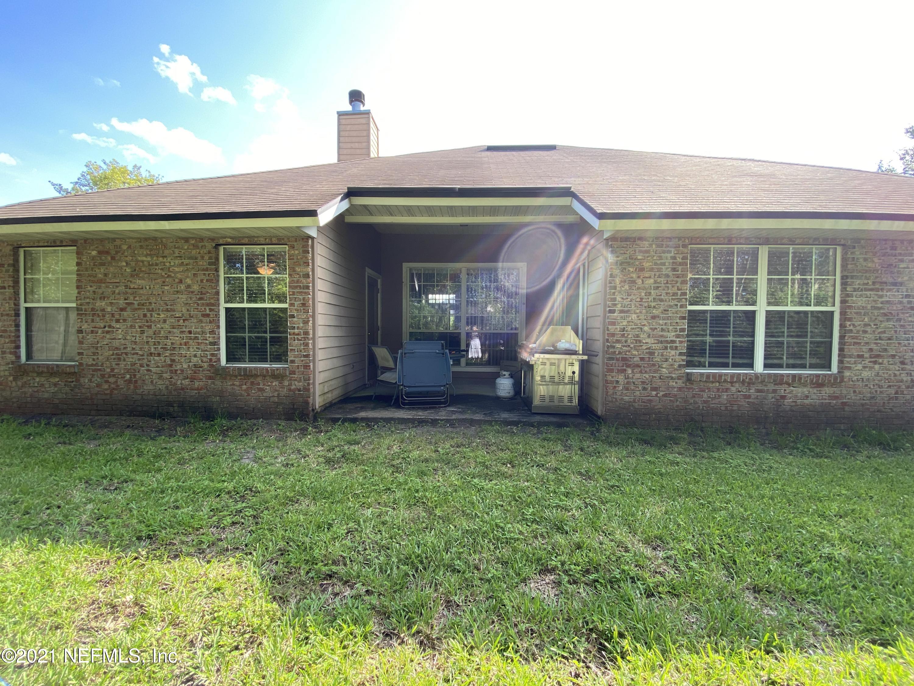4387 Pebble Brook Drive Jacksonville, FL 32224 - Photo 26 of 30 a front view of a house with garden