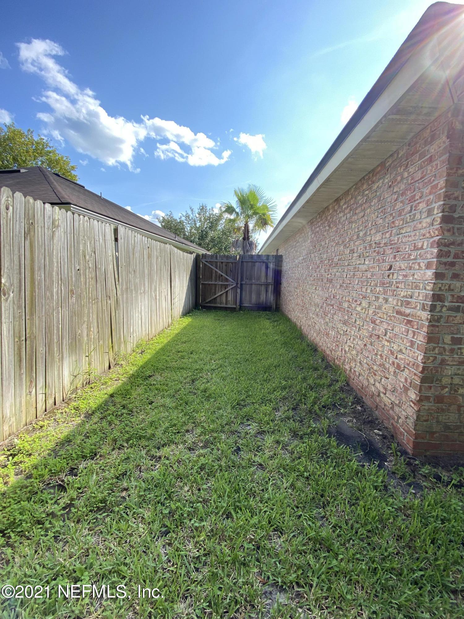 4387 Pebble Brook Drive Jacksonville, FL 32224 - Photo 27 of 30 a view of a backyard with a garden