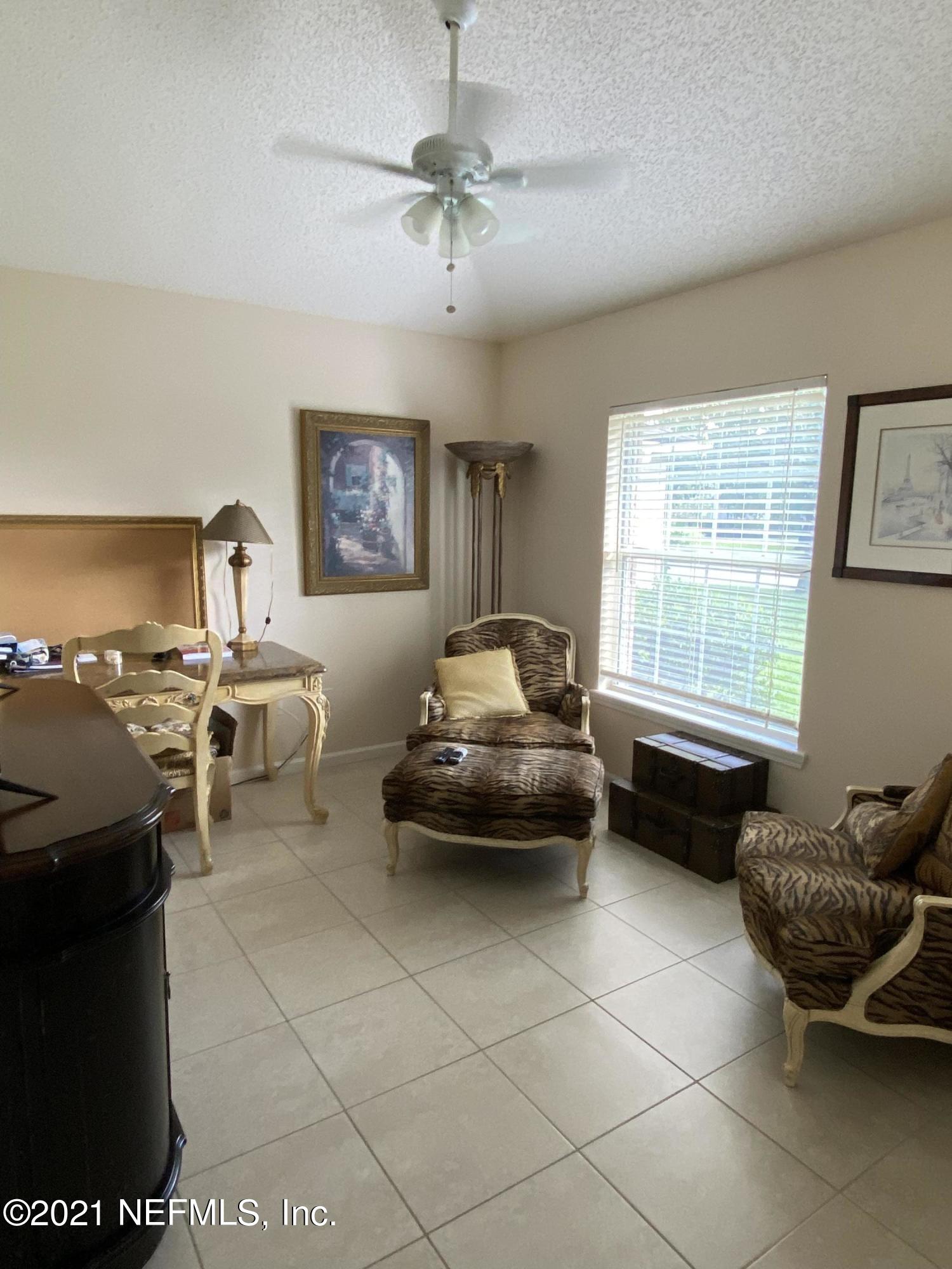 4387 Pebble Brook Drive Jacksonville, FL 32224 - Photo 4 of 30 a living room with furniture and a window