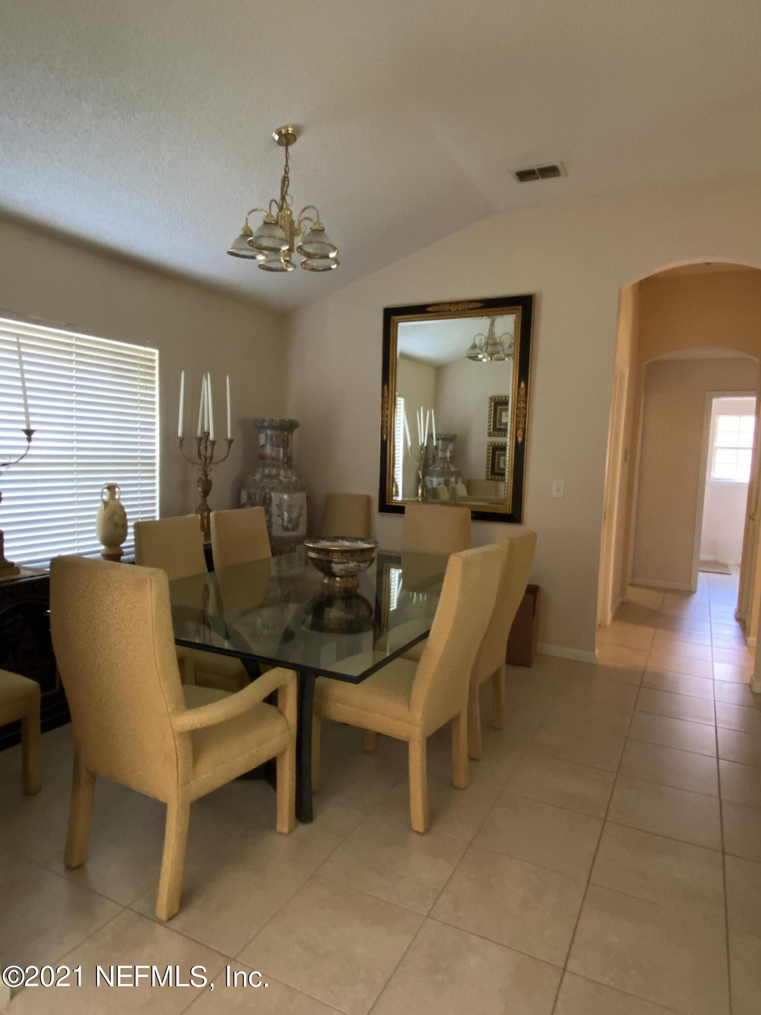 4387 Pebble Brook Drive Jacksonville, FL 32224 - Photo 5 of 30 a view of a dining room with furniture