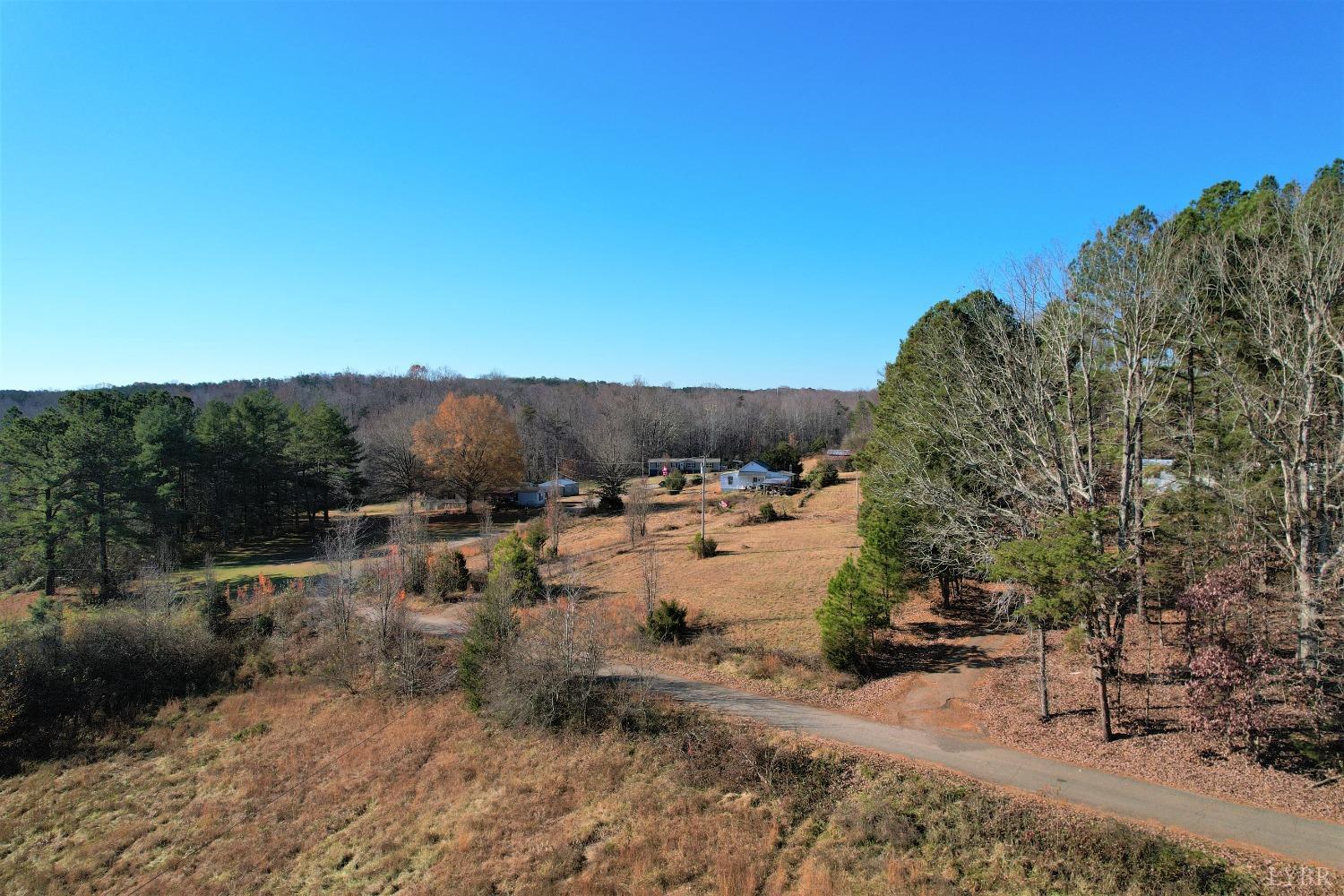 5134 Whispering Pines Road Cascade, VA 24069 - Photo 16 of 45 a view of a dry yard with trees