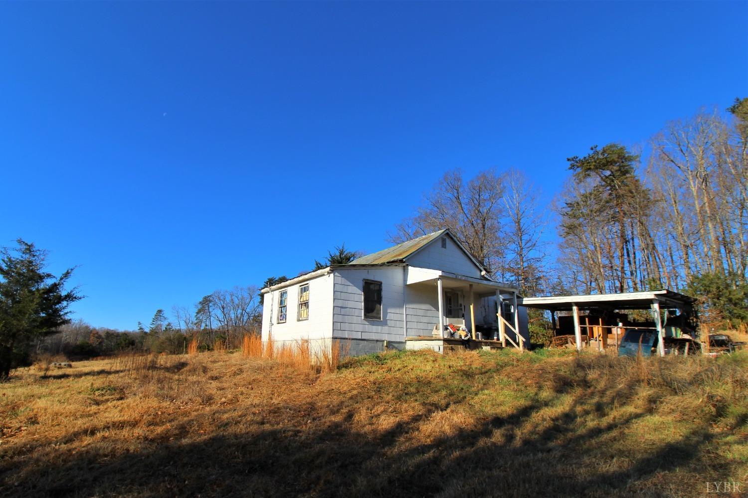 5134 Whispering Pines Road Cascade, VA 24069 - Photo 21 of 45 a front view of a house with a yard