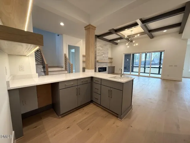 a spacious bathroom with a granite countertop sink mirror and shower
