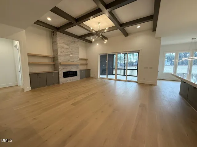 a spacious bathroom with a double vanity sink toilet and shower