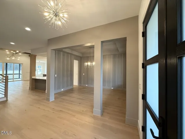 a large kitchen with kitchen island a sink stainless steel appliances and cabinets