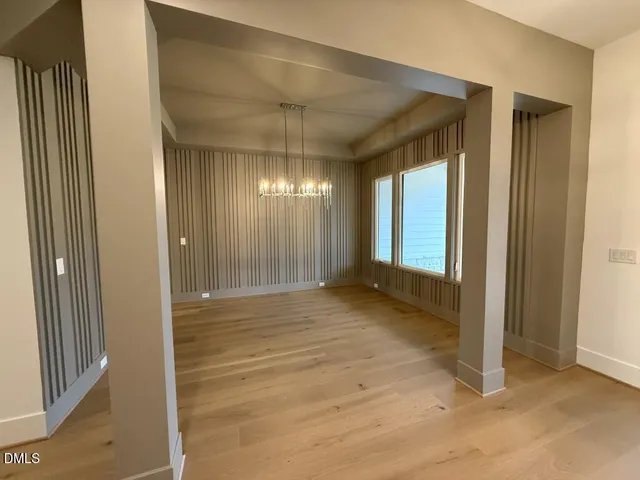 a view of a kitchen with white cabinets