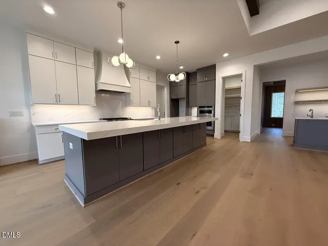 a view of room with window and wooden floor