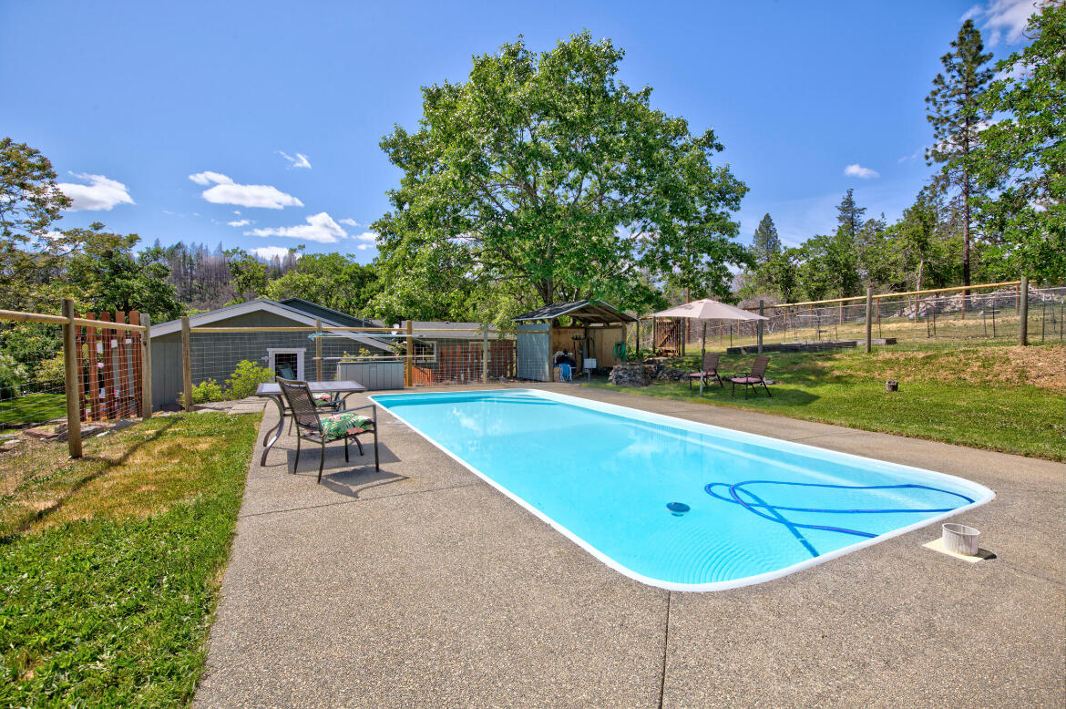 1360 Oxyoke Road Grants Pass, OR 97526 - Photo 8 of 39 a view of a swimming pool with a patio