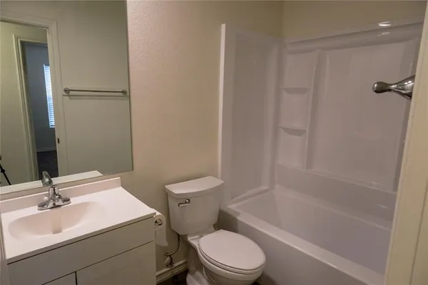 a bathroom with a sink a toilet and a bathtub
