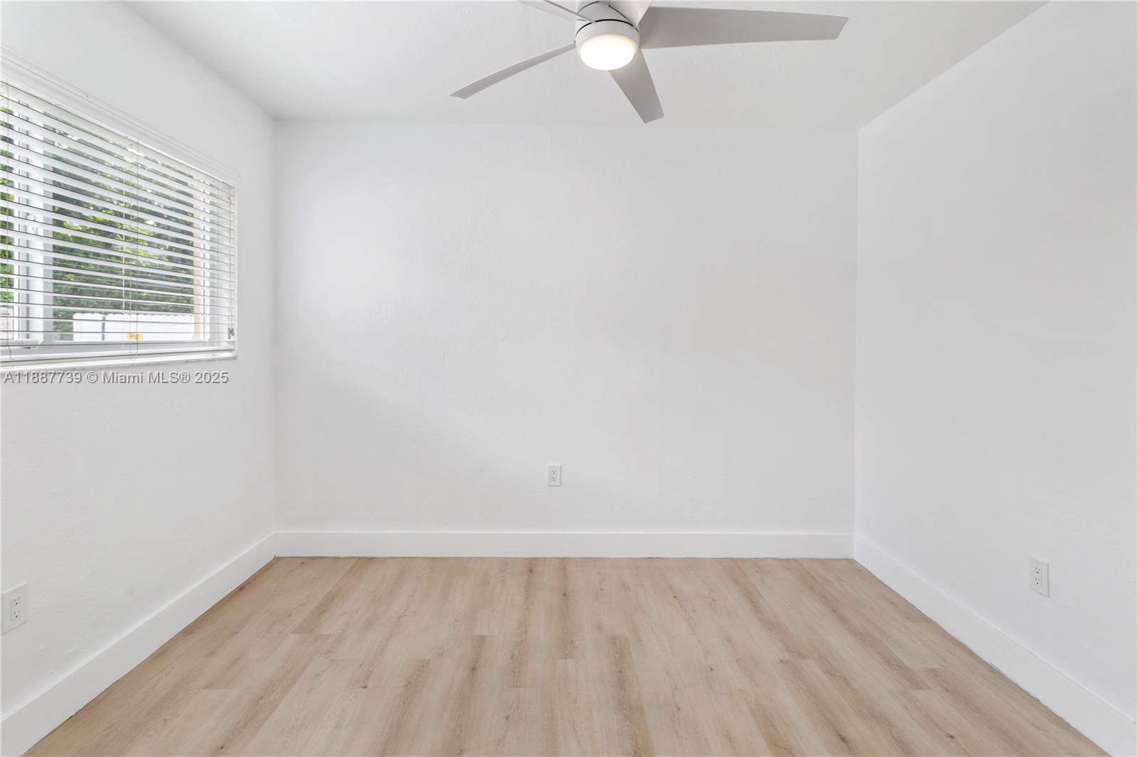 6330 Southwest 79th Street, Unit 5 South Miami, FL 33143 - Photo 11 of 19 an empty room with a window