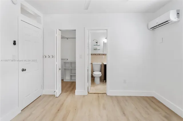 a view of an empty room with glass door