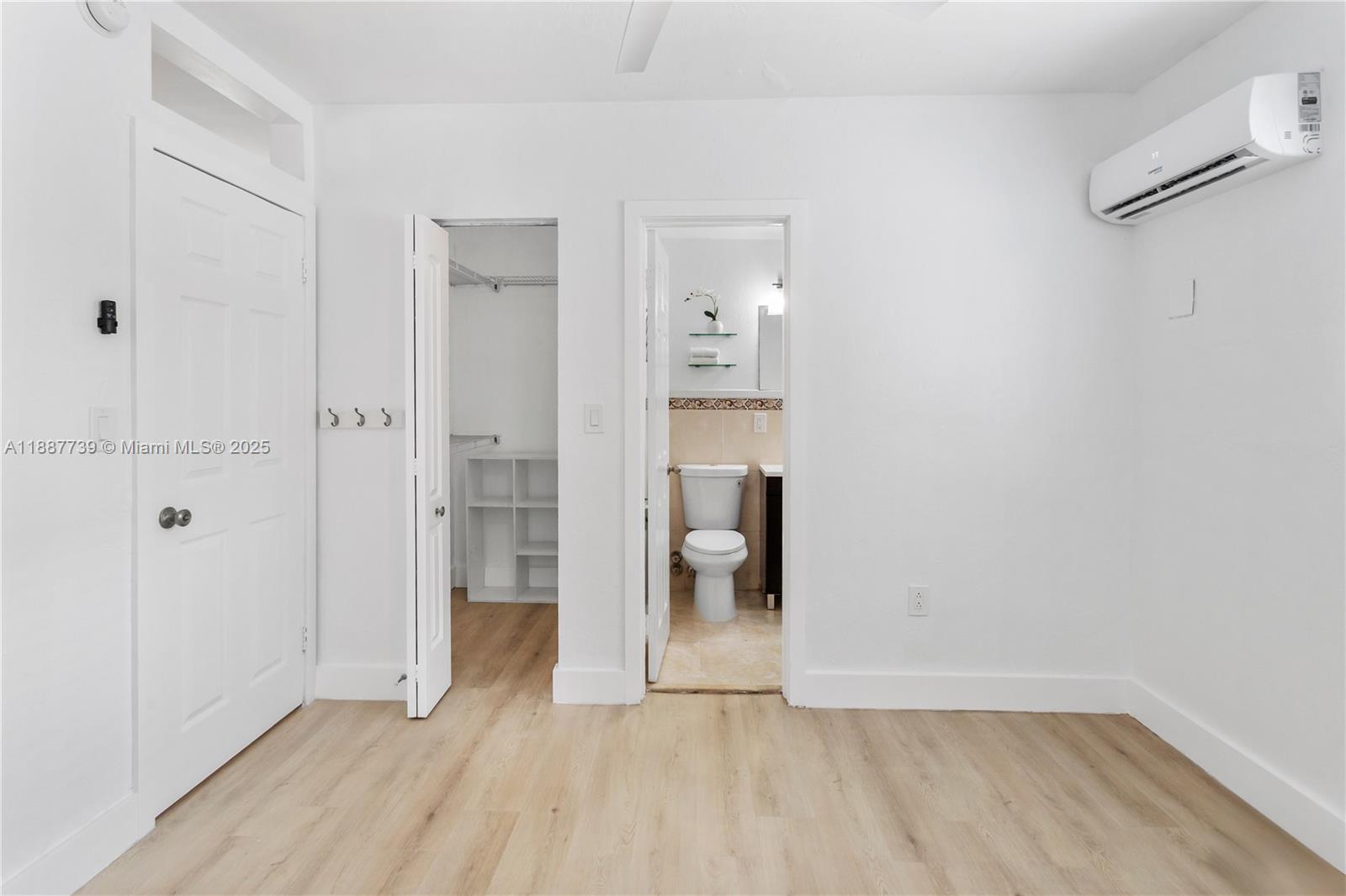 6330 Southwest 79th Street, Unit 5 South Miami, FL 33143 - Photo 16 of 19 a view of an empty room with glass door