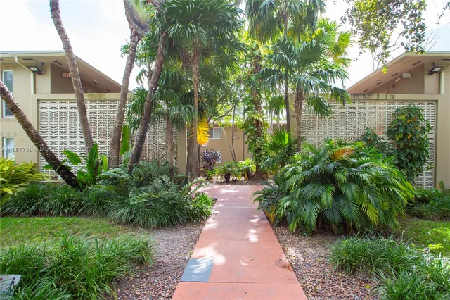 a view of a pathway both side of house