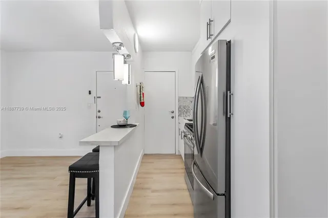a view of a kitchen from the hallway