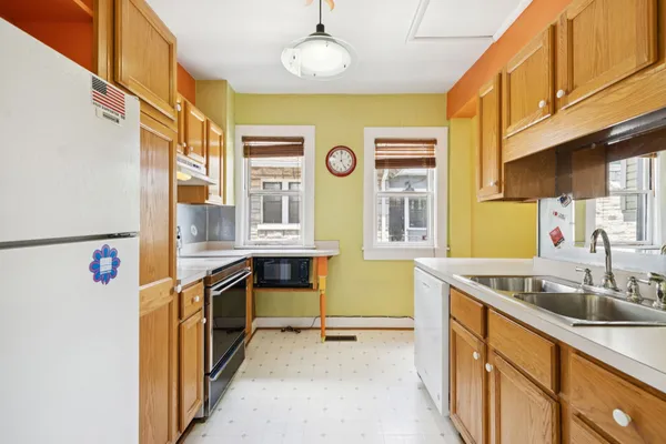 a kitchen that has a sink and a stove