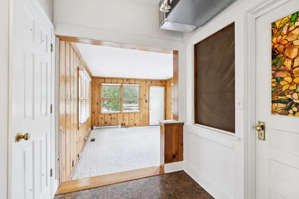 a view of an empty room with a window