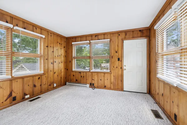a view of an empty room with a window