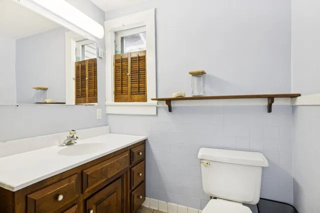 a bathroom with a sink and a window