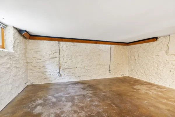 a view of a room with a table and windows