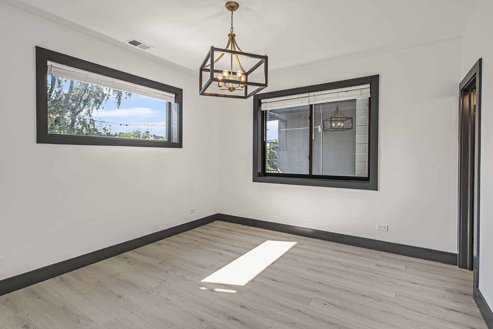 6504 South Ingleside Avenue, Unit 2 Chicago, IL 60637 - Photo 6 of 17 a view of a room with wooden floor and window