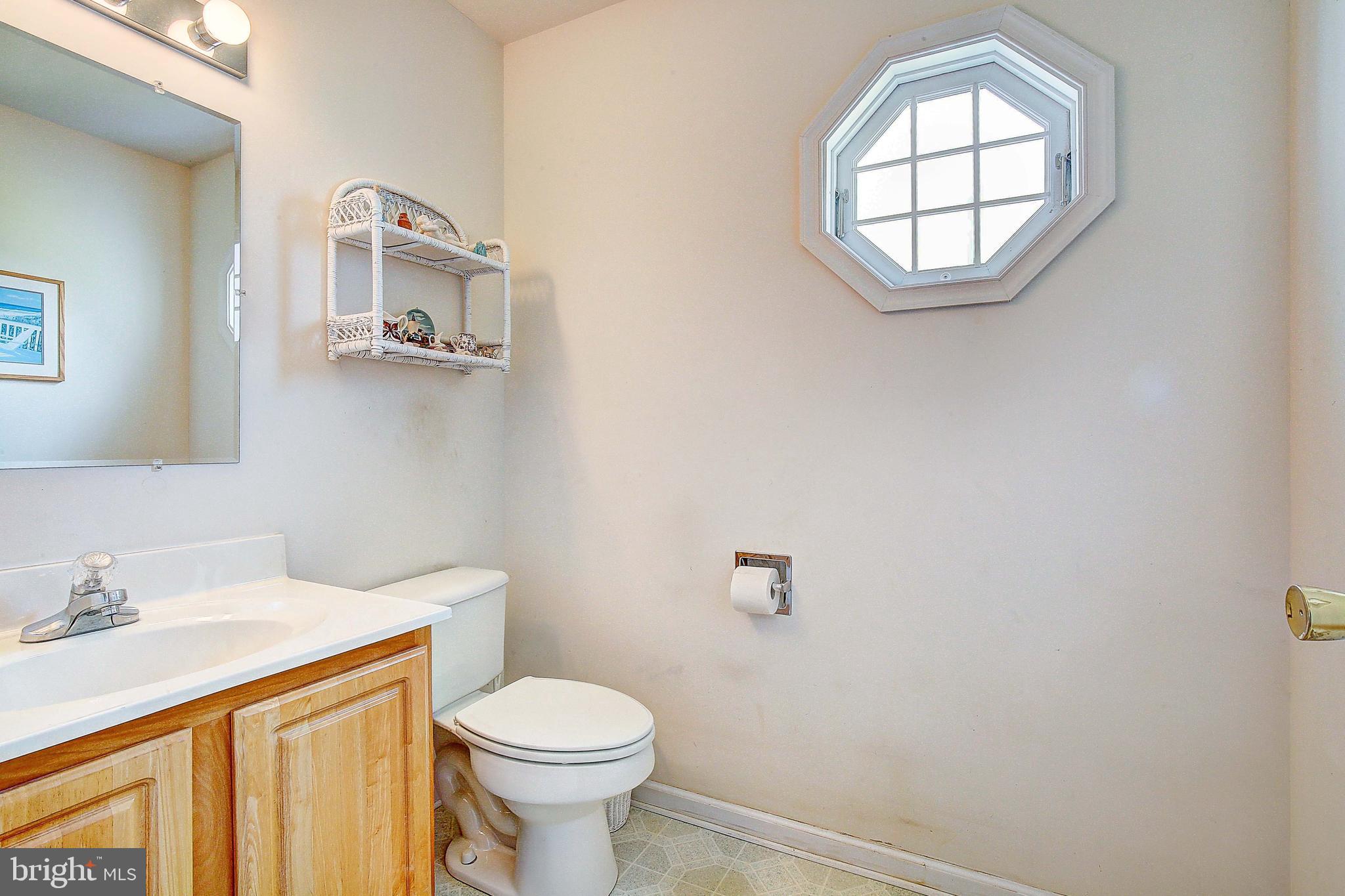 4650 Paul Hance Road Huntingtown, MD 20639 - Photo 40 of 57 a bathroom with a sink and a toilet
