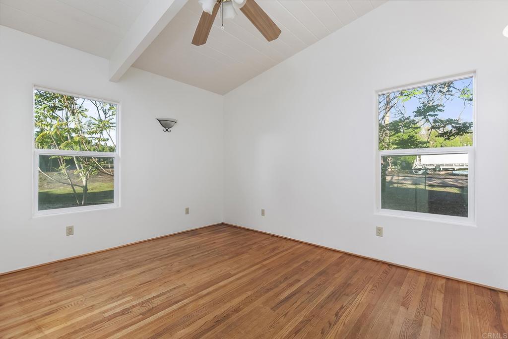 10546 Valle Vista Road Lakeside, CA 92040 - Photo 19 of 66 a view of an empty room with wooden floor and a window