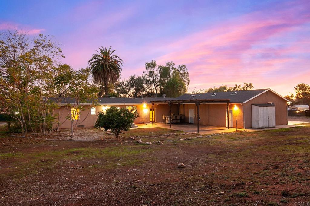10546 Valle Vista Road Lakeside, CA 92040 - Photo 32 of 66 a front view of house with yard and trees in the background