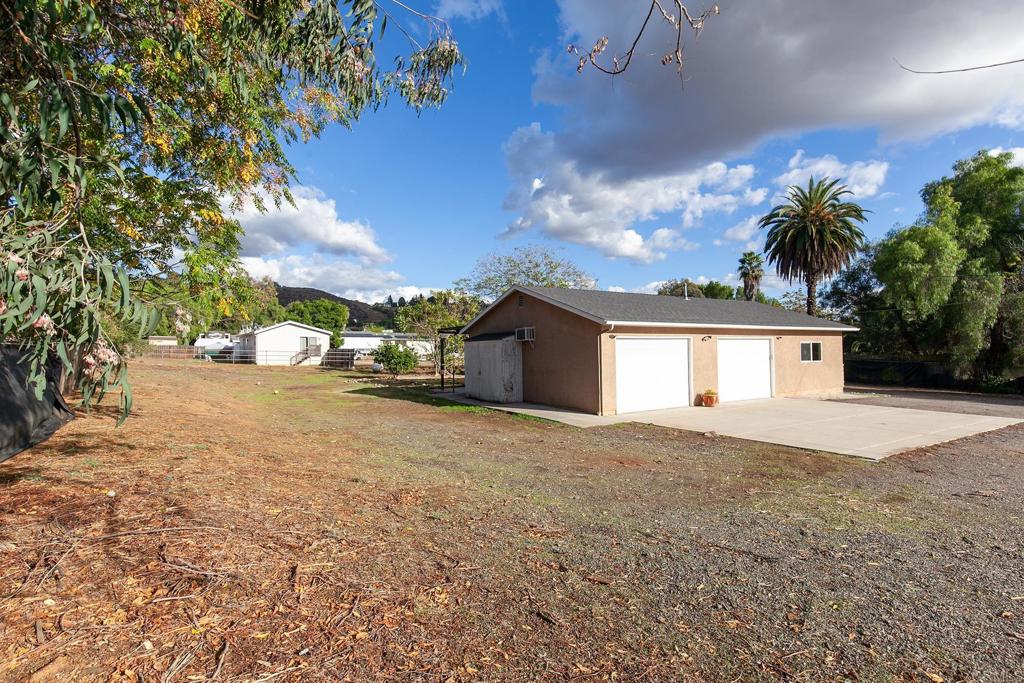 10546 Valle Vista Road Lakeside, CA 92040 - Photo 35 of 66 a view of large house with a yard and garage
