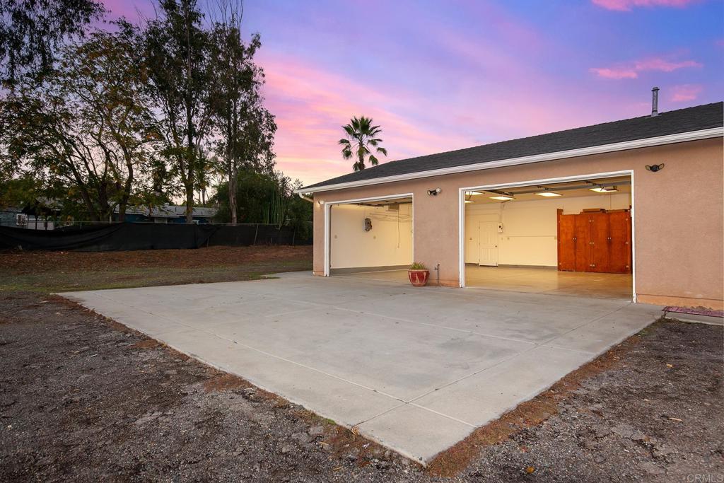10546 Valle Vista Road Lakeside, CA 92040 - Photo 36 of 66 a front view of a house with a yard and garage