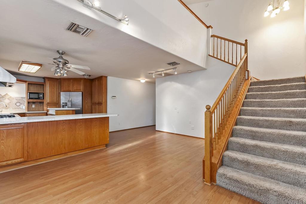 10546 Valle Vista Road Lakeside, CA 92040 - Photo 43 of 66 a view of staircase and kitchen with wooden floor