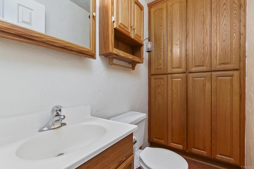 10546 Valle Vista Road Lakeside, CA 92040 - Photo 46 of 66 a bathroom with a sink a toilet and shower