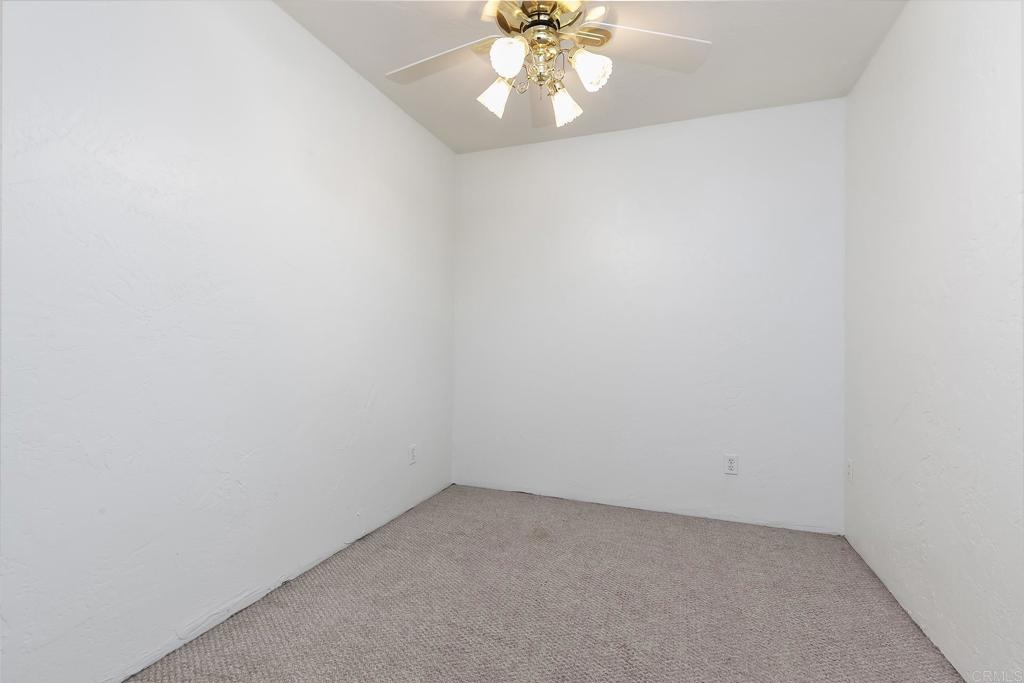 10546 Valle Vista Road Lakeside, CA 92040 - Photo 55 of 66 an empty room with a chandelier fan