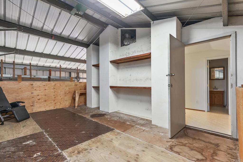 10546 Valle Vista Road Lakeside, CA 92040 - Photo 62 of 66 a view of a room with wooden floor and a fireplace