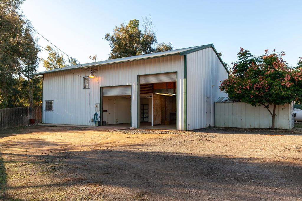 10546 Valle Vista Road Lakeside, CA 92040 - Photo 63 of 66 a view of a house with backyard and tree