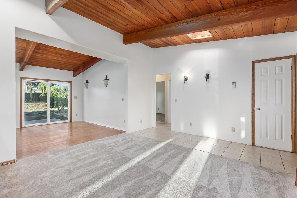 10546 Valle Vista Road Lakeside, CA 92040 - Photo 7 of 66 a view of an empty room with wooden floor and a window