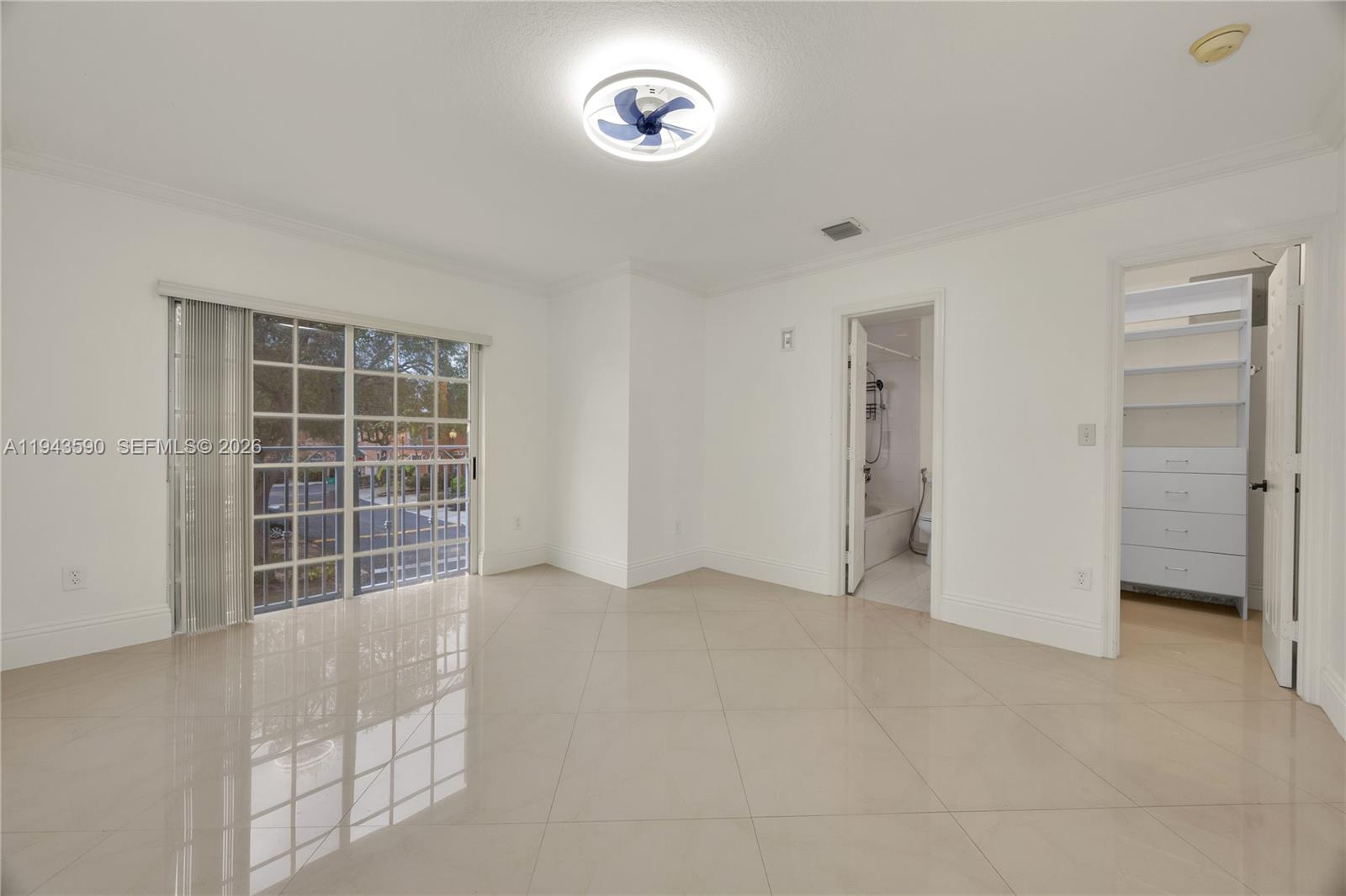 7773 Southwest 94th Lane Miami, FL 33156 - Photo 13 of 50 an empty room with a window and a cabinet