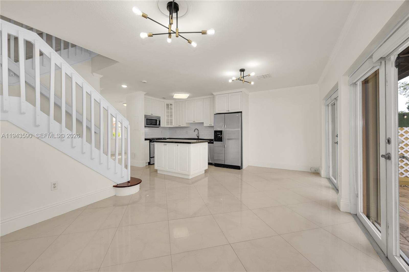7773 Southwest 94th Lane Miami, FL 33156 - Photo 42 of 50 a view of a kitchen with a sink and microwave