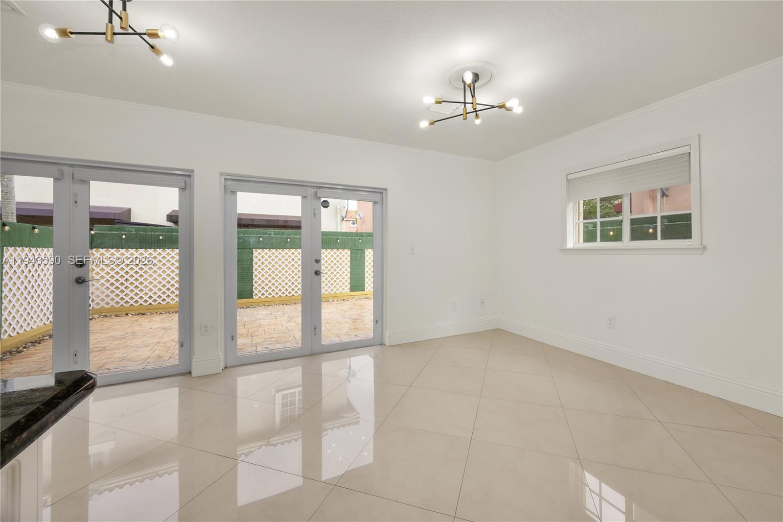 7773 Southwest 94th Lane Miami, FL 33156 - Photo 44 of 50 a view of an empty room with a window