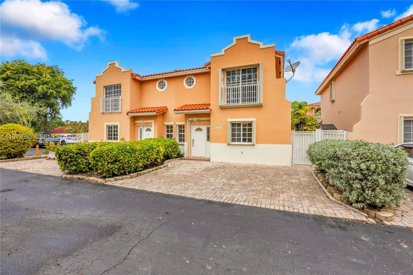 7773 Southwest 94th Lane Miami, FL 33156 - Photo 46 of 50 a front view of a house with a yard