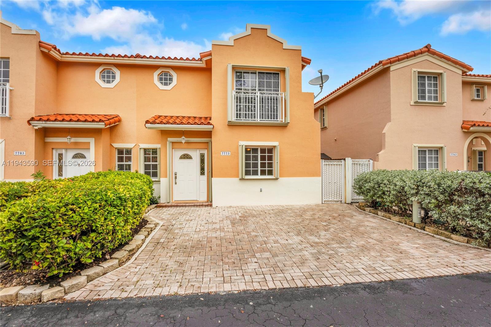 7773 Southwest 94th Lane Miami, FL 33156 - Photo 48 of 50 front view of a house with a yard