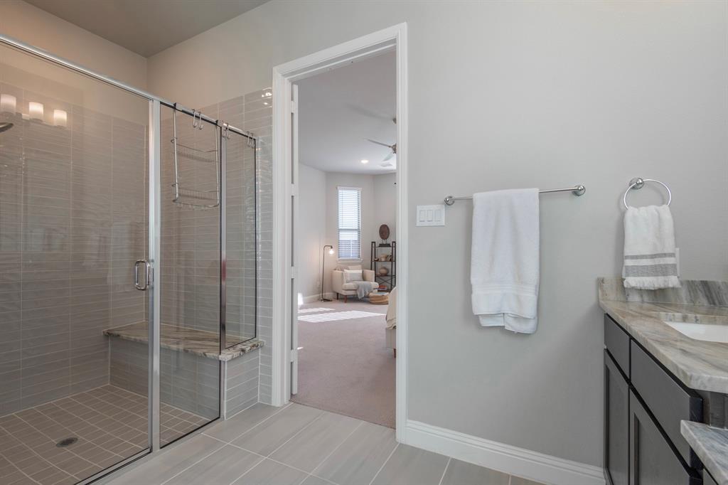 16650 Nightshade Road Frisco, TX 75033 - Photo 23 of 40 a bathroom with a shower and a sink