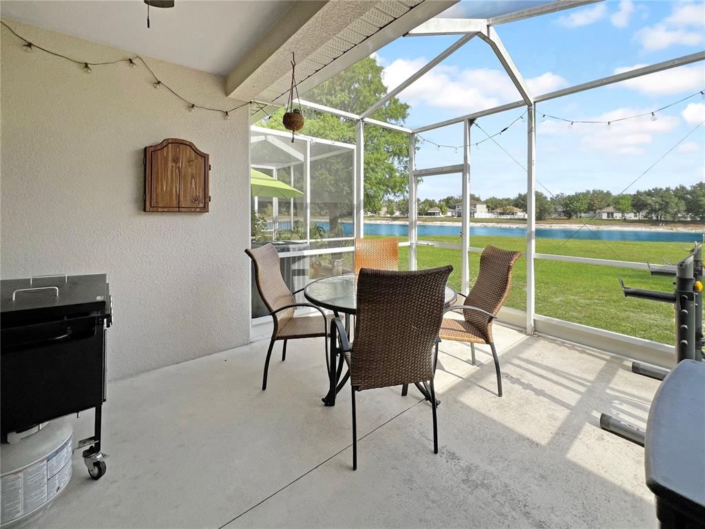 15767 Stable Run Drive Spring Hill, FL 34610 - Photo 15 of 34 a view of a terrace with furniture and a table