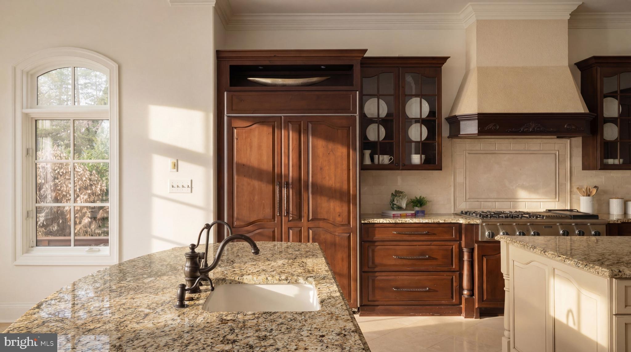 9250 Persimmon Tree Road Potomac, MD 20854 - Photo 22 of 47 a kitchen with a sink cabinets and window