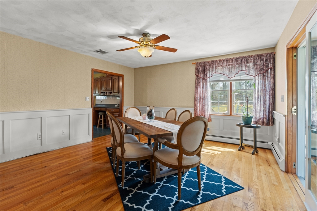 36 High Street Freetown, MA 02702 - Photo 13 of 42 a dining room with furniture a chandelier and wooden floor