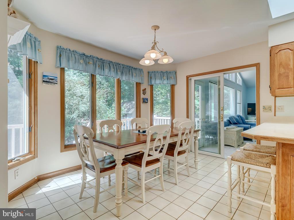 32 Harpoon Road Ocean Pines, MD 21811 - Photo 23 of 37 a view of a dining room with furniture wooden floor and chandelier