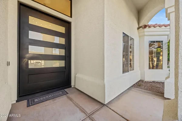 a view of a living room and entryway